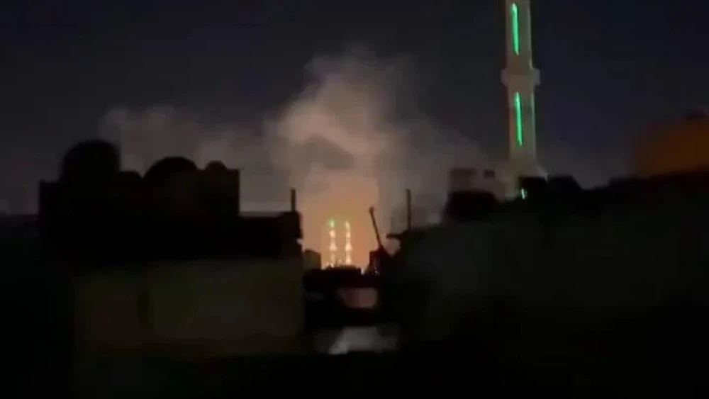 Still from amateur video appearing to show aftermath of missile strike in Damascus area. Source: Twitter
