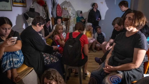 Israelis take cover in a public shelter in Jerusalem during a ballistic missile attack fired from Iran on June 15, 2025. Photo by Noam Revkin Fenton/Flash90.