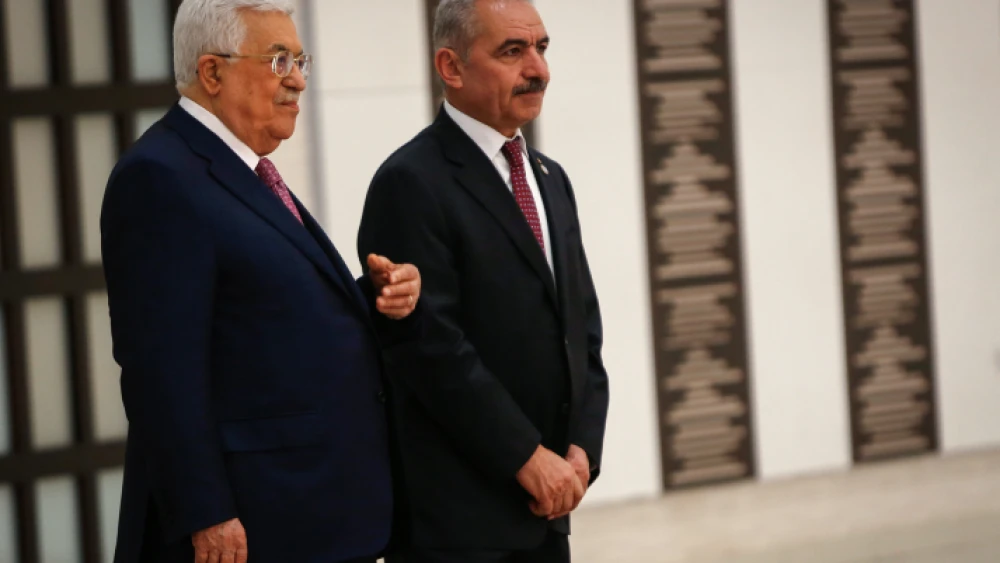 Palestinian Authority Prime Minister Mohammad Shtayyeh (right) and P.A. leader Mahmoud Abbas at the swearing-in ceremony of the new government at the P.A. headquarters in Ramallah, April 13, 2019. Photo by Nasser Ishtayeh/Flash90.