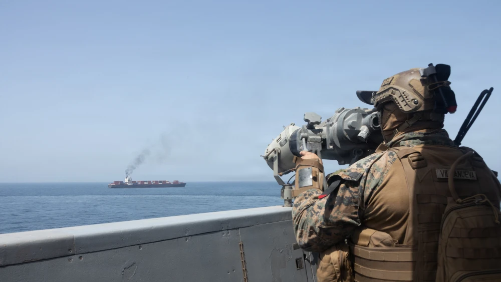 U.S. forces patrol the Arabian Sea near M/V Touska on April 20, 2026, after firing upon the Iranian-flagged vessel that the U.S. accused of attempting to violate the U.S. naval blockade of Iranian ports near the Strait of Hormuz. Handout Photo by the U.S. Navy via Getty Images.