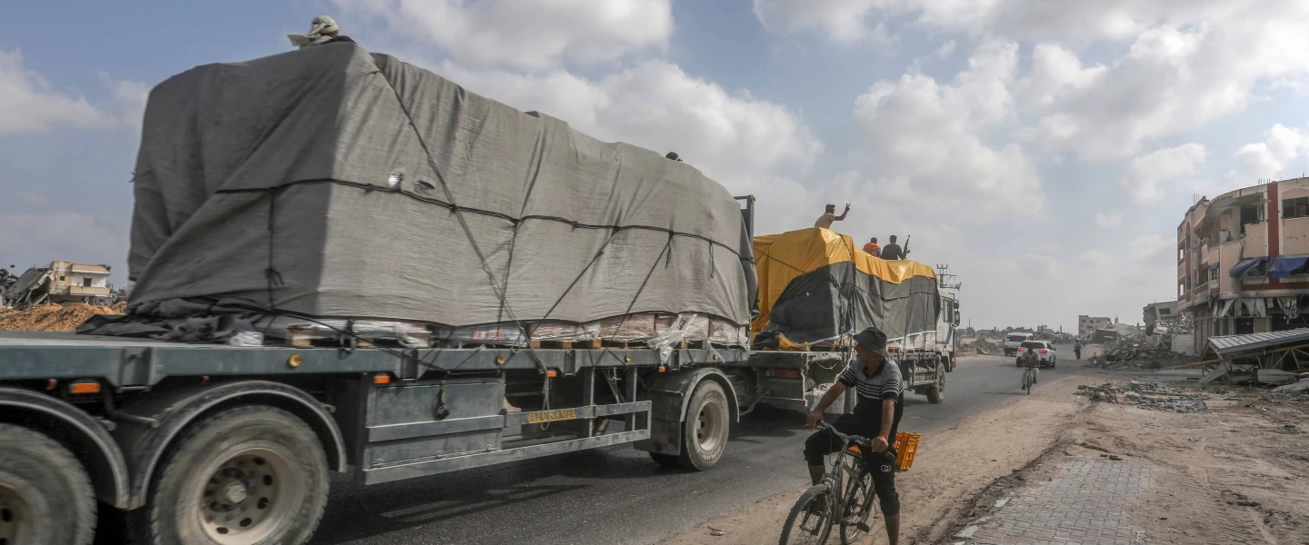 Trucks loaded with International humanitarian aid enter Gaza through the Israeli Kerem Shalom Crossing, in the southern Gaza Strip, on July 1, 2024. Photo by Abed Rahim Khatib/Flash90.
