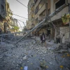 Palestinians inspect the damage to their homes following an Israeli airstrike on the Nuseirat refugee camp in the central Gaza Strip, on May 23, 2026. Photo by Ali Hassan/Flash90.