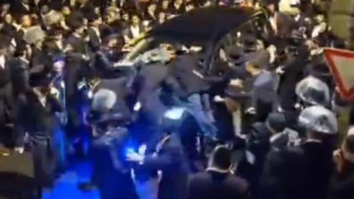 Haredim surround the car of Shas Party MK Yoav Ben-Tzur in Jerusalem, Nov. 15, 2025. Credit: Twitter/N12.