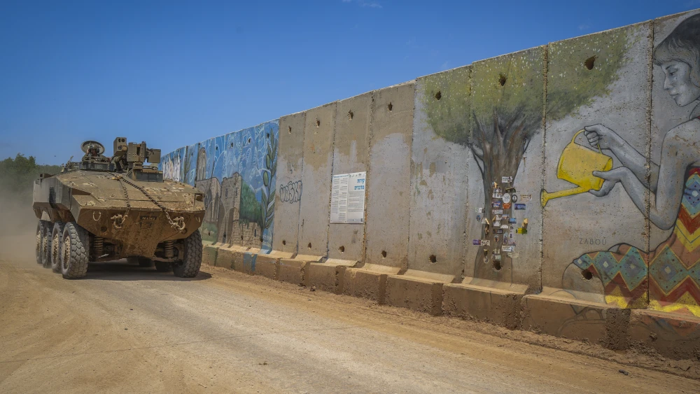 An Israel Defense Forces armored personnel carrier is seen near a concrete wall in Moshav Shtula, along the border with Lebanon, during a ceasefire, April 27, 2026. Photo by Ayal Margolin/Flash90.