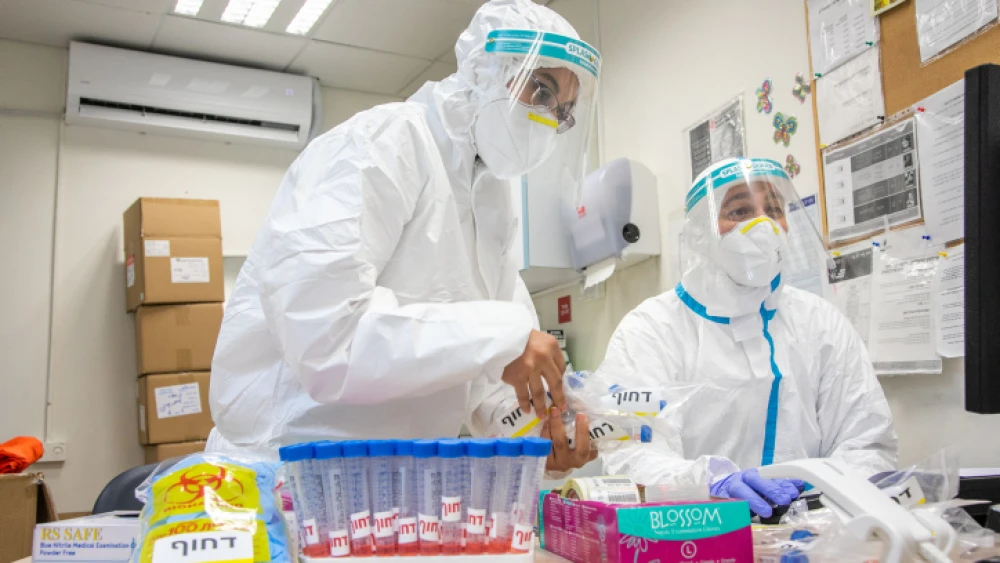 Israeli lab workers test samples for coronavirus in Modi'in, on July 7, 2020. Photo by Yossi Aloni/Flash90.