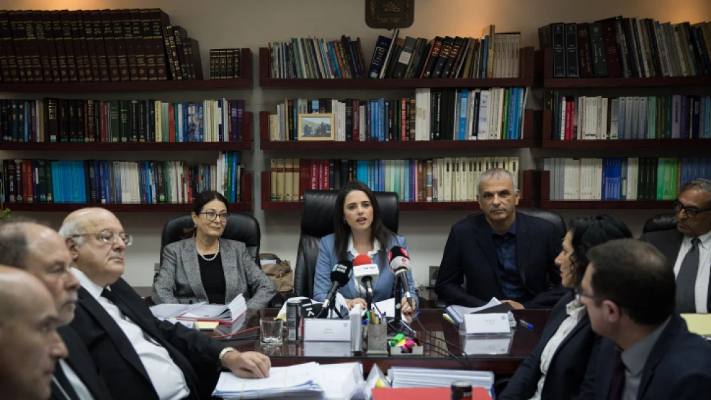 Israeli Justice Minister Ayelet Shaked (center) seen with Supreme Court president Esther Hayut (left), Finance Minister Moshe Kahlon (right) and members of the Israeli Judicial Selection Committee at a meeting of the committee at the Justice Ministry in Jerusalem on Feb. 22, 2018. Photo by Hadas Parush/Flash 90.