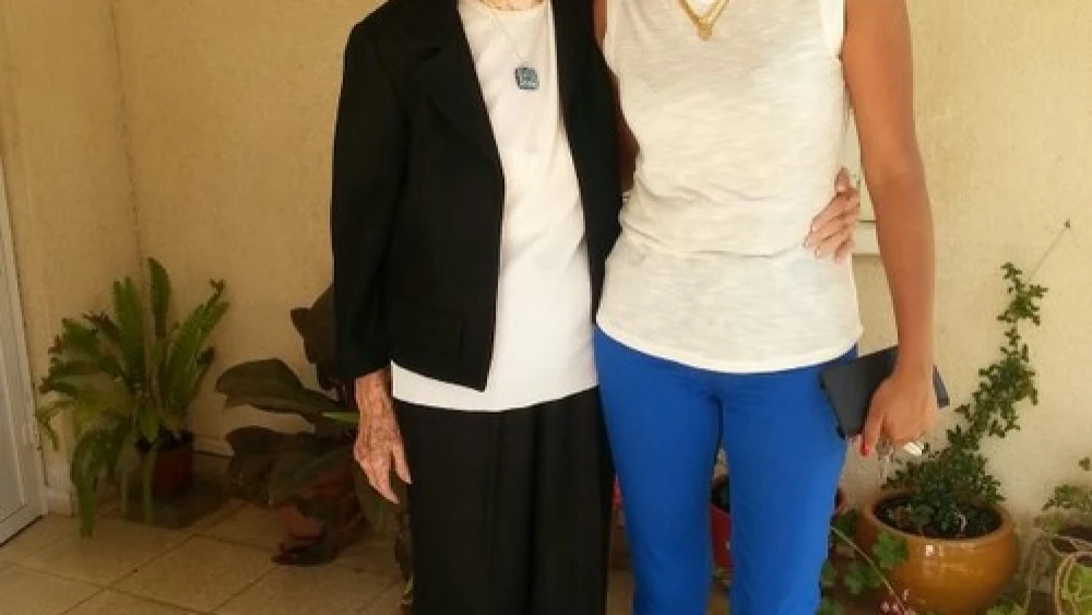 Janet Tauro (right), a foreign worker from Mumbai, is the caretaker for Varda Kahanovich (left), a 90-year-old Israeli woman living on Kibbutz Maagan Michael. "Today the foreign caregiver that lives with the patient—this is the most common way to grow old in Israel," says Yaron Bengera, vice president of Yad Beyad, a Tel Aviv-based agency that recruits foreign workers. Credit: Courtesy.