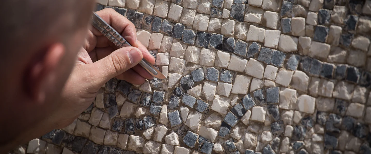 A 1,500-year-old mosaic floor with a Greek inscription, shown at the Rockefeller Museum in Jerusalem's Old City on Aug. 23, 2017. Unearthed near the Damascus Gate in the Old City, the ancient inscription mentions the Byzantine emperor Justinian. Photo by Hadas Parush/Flash90.