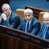 Israeli Prime Minister Naftali Bennett, Foreign Minister Yair Lapid Defense Minister Benny Gantz attend a vote on the "settler law" bill at the Knesset, June 6, 2022. Photo by Yonatan Sindel/Flash90.