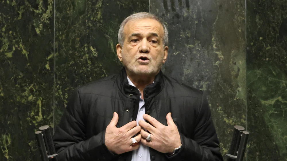 Iran's President Masoud Pezeshkian addresses members of parliament in Tehran on March 2, 2025, during impeachment proceedings against the country's finance minister. Parliament is expected to vote on the impeachment in the afternoon on March 2, with any dismissal requiring the backing of a majority of the 290-seat body. (Photo by ATTA KENARE / AFP) (Photo by ATTA KENARE/AFP via Getty Images)