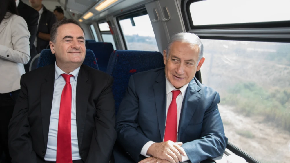 Minister of Transportation Israel Katz (left) and Israeli Prime Minister Benjamin Netanyahu take a test drive of the Jerusalem-Tel Aviv express train in central Israel on Sept. 20, 2018. Photo by Noam Revkin Fenton/Flash90.