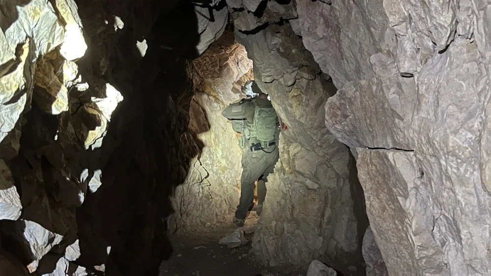 An Israeli soldier walks through a Hezbollah terror tunnel uncovered beneath the Beaufort Ridge in Southern Lebanon, in a photo released June 7, 2026, by the Israel Defense Forces. Credit: IDF.