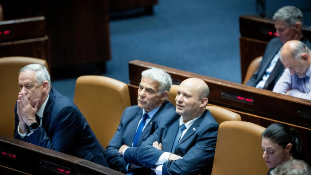 Former Israeli Prime Minister Naftali Bennett, current Israeli leader Yair Lapid and Defense Minister Benny Gantz attend a plenum session in the Knesset on May 23, 2022. Photo by Yonatan Sindel/Flash90.