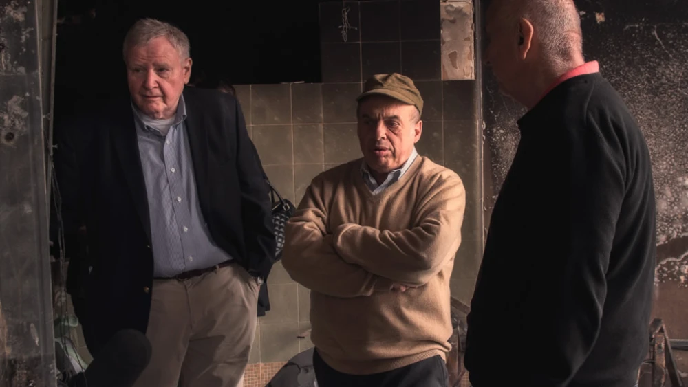 Shrage with Natan Sharansky (center), then head of the Jewish Agency, in Israel in November 2016, assessing damage, and visiting people and institutions that bore the brunt of devastating fires in Haifa. Credit: CJP.