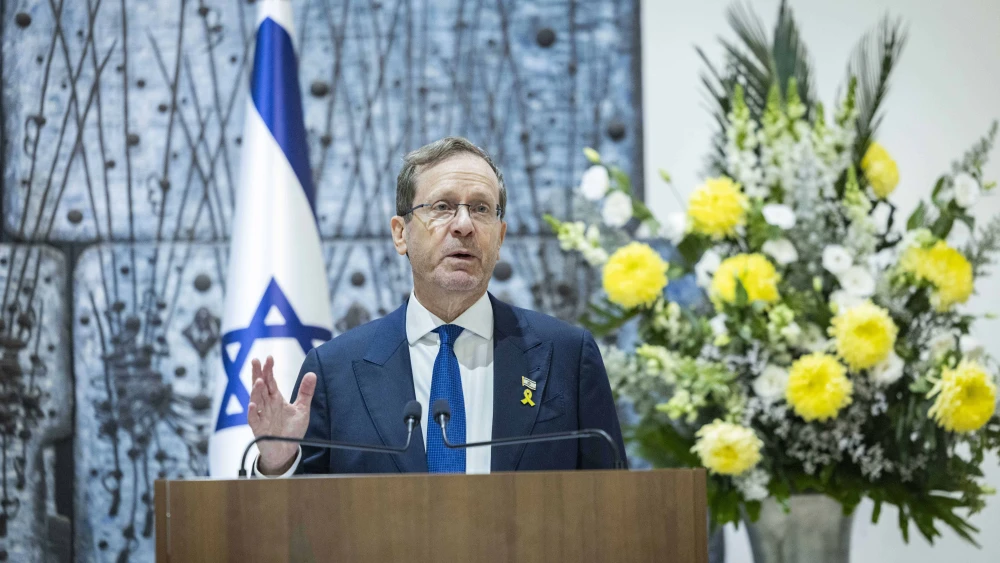 Israeli President Isaac Herzog speaks during a ceremony marking the lighting of the first Chanukah candle at the President’s Residence in Jerusalem on Dec. 14, 2025. Photo by Chaim Goldberg/Flash90.