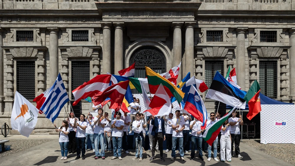 Activists wave the national flags of the 27 member states of the European Union during "Festa dell'Europa," organized by AtenEU, a network of young Europeanist university students, as part of the Europe Day celebrations at Piazza San Fedele in Milan, Italy, on May 9, 2026. Photo by Emanuele Cremaschi/Getty Images.