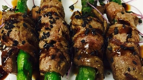 Click photo to download. Caption: One of the appetizers at Houston's 15th Gourmet Kosher Extravaganza, beef-wrapped asparagus by Jason Goldstein of Genesis Steakhouse. Credit: Genesis Steakhouse via Facebook.