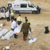ZAKA emergency volunteers transport the bodies of nine students killed during flash floods while hiking as a group in the Nahal Tzafit riverbed on April 26, 2018. Photo courtesy of ZAKA.