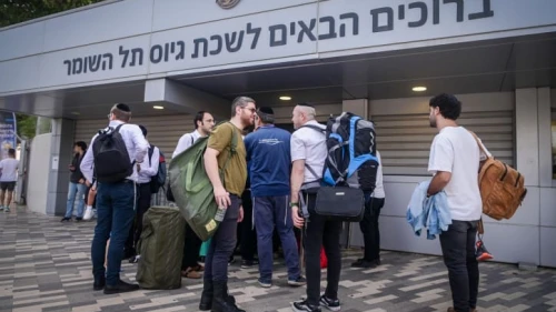 Haredi men who decided to join the IDF arrive at the army's recruitment office at Camp Yaakov Dori in Ramat Gan's Tel Hashomer neighborhood, Oct. 23, 2023. Photo by Avshalom Sassoni/Flash90.