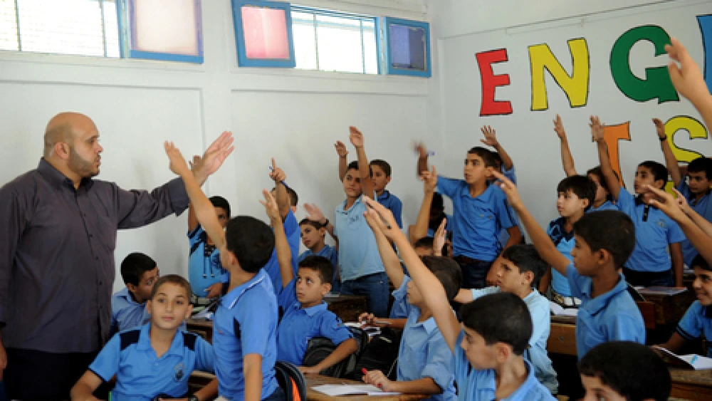 Boys raise their hands at a U.N. school in the Gaza Strip, September 2011. Credit: U.N. Photo/Shareef Sarhan.
