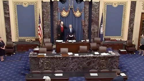 Rabbi Ari Berman, at right, president of Yeshiva University, in the Senate chambers where he gave a benediction on Sept. 10, 2025. Credit: Courtesy of Yeshiva University.
