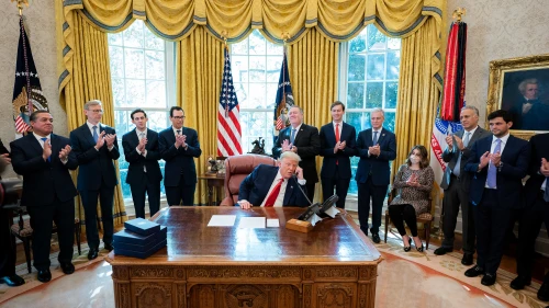 U.S. President Donald Trump participates in a phone call with Sudanese Chairman of the Sovereignty Council Abdel Fattah al-Burhan, Sudanese Prime Minister Abdalla Hamdok, and Israeli Prime Minister Benjamin Netanyahu to discuss Sudan’s historic progress towards democracy with its recognition of Israel and opportunities to advance peace in the region on Oct. 23, 2020, in the Oval Office of the White House. Credit: Tia Dufour/The White House.