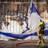 Firefighters at the site of warehouses destroyed in a Hezbollah missile attack, Kiryat Shmona, Sept. 24, 2024. Photo by Ayal Margolin/Flash90.