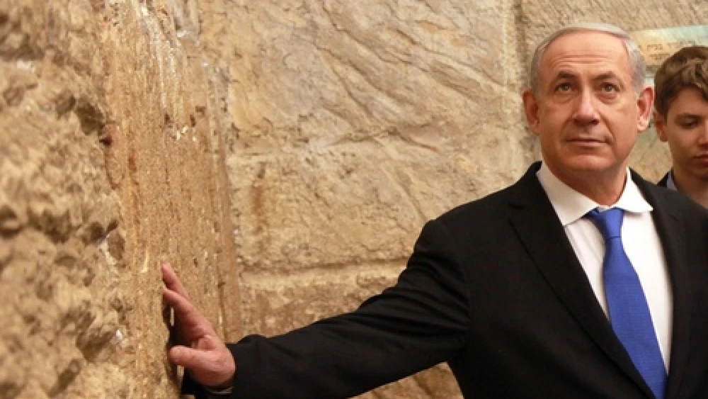 Click photo to download. Caption: Israeli Prime Minister Benjamin Netanyahu at the Western Wall on January 22, 2013. Credit: Marc Israel Sellem/POOL/Flash90.