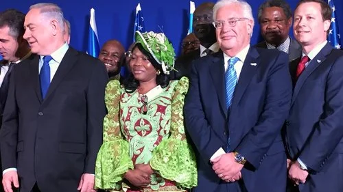 In front, Israeli Prime Minister Benjamin Netanyahu (left), U.S. Ambassador to Israel David Friedman (third from left) and Power Africa initiative Coordinator Andrew Herscowitz (right) attend the Dec. 4 signing of a memorandum of understanding on Israel's entrance into Power Africa. Credit: Alex Traiman.