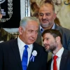 Likud leader Benjamin Netanyahu speaks with Religious Zionism Party head Bezalel Smotrich at the swearing-in of the 25th Knesset in Jerusalem, Nov. 15, 2022. Photo by Olivier Fitoussi/Flash90.