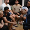Israeli Prime Minister Benjamin Netanyahu talks with the family of IDF Sgt. First Class (res.) Omer Smadga, who was killed in action in the Gaza Strip, June 24, 2024. Credit: Haim Zach/GPO