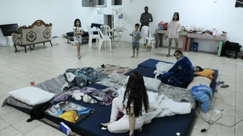 Two Jewish families spend their days in a bomb shelter, as rockets are fired by Hamas from Gaza into Israel in the southern Israeli city of Ashkelon, May 13, 2021. Photo by Avi Roccah/Flash90.