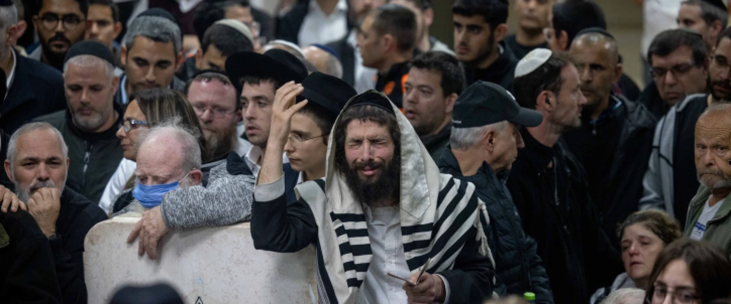 Mourners attend the funeral at the Beit Shemesh Cemetery for Eli and Natalie Mizrahi, who were murdered in the shooting attack in Jerusalem's Neve Ya'akov neighborhood on Friday, Jan. 28, 2023. Photo by Yonatan Sindel/Flash90.
