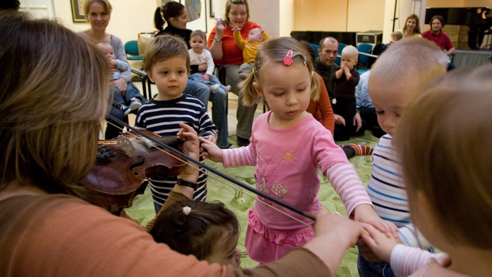Rocking and music nursery time: Children and parents take part in a program at Balint House in Budapest, Hungary. Credit: JDC.