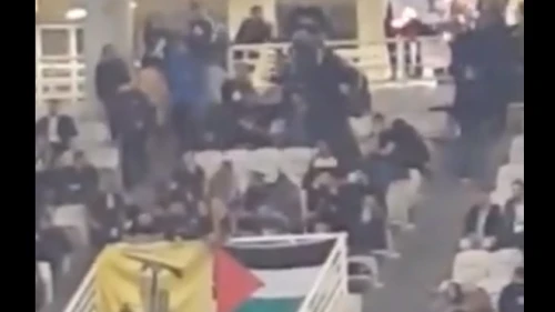Fans of the Greek basketball team AEK Athens waved Hezbollah and Palestinian flags, and burned an Israeli flag during a game with the Israeli team Hapoel Jerusalem in Athens. Source: Screenshot.