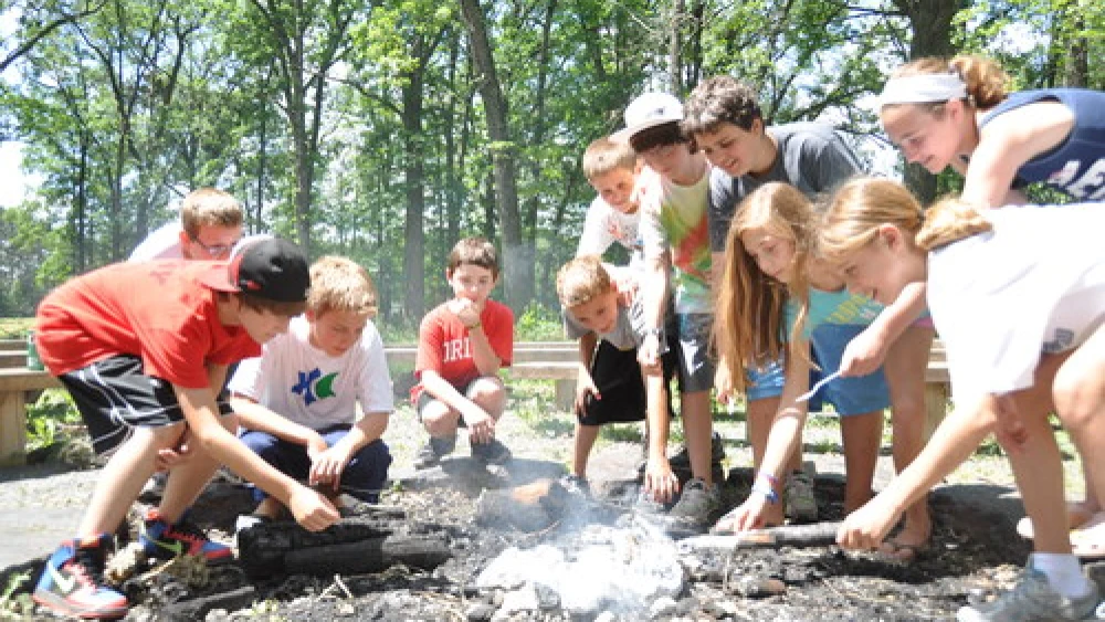 A campfire at Webster, Wisconsin-based Herzl Camp, a JCamp180-supported summer camp. Credit: Herzl Camp.