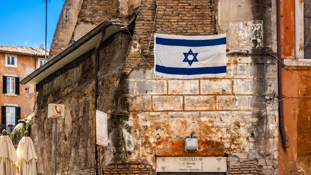A view of the Israeli flag fixed to a wall in the heart of Rome’s Jewish ghetto, in the Rione Sant’Angelo district of Rome in the Lazio region of Italy on April 18, 2024. Photo by JC Milhet/Hans Lucas/AFP via Getty Images.