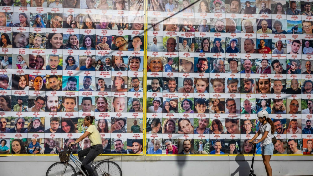 Pictures of civilians held hostage by Hamas terrorists in the Gaza Strip are seen in Jerusalem, Nov. 24, 2023. Photo by Yonatan Sindel/Flash90.