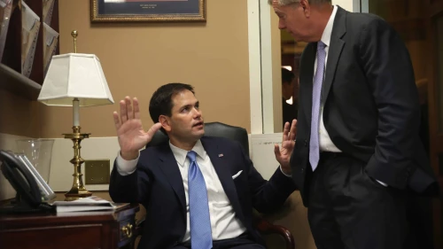 Sen. Marco Rubio (left) speaks to Sen. Lindsey Graham before a news conference on Capitol Hill in Washington on the conflict between Israel and Hamas, July 24, 2014. Photo by Alex Wong/Getty Images.
