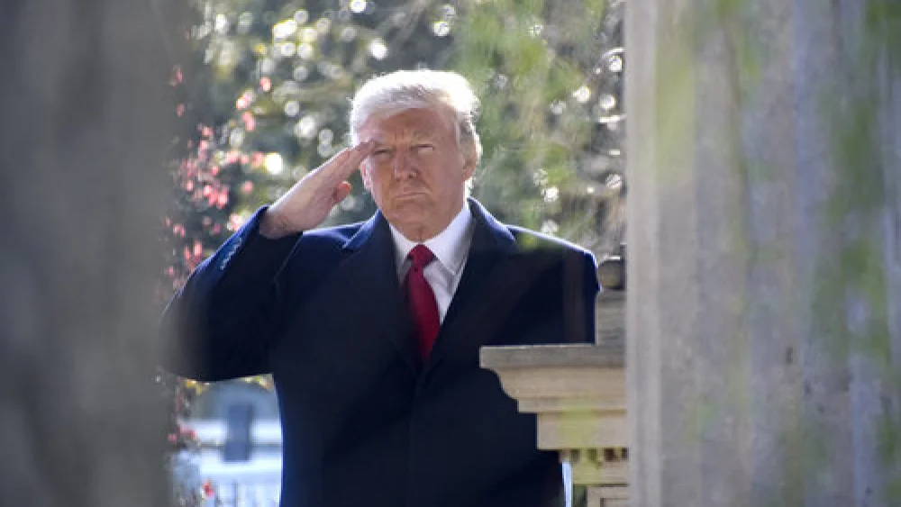President Donald Trump gives a salute at the gravesite of former President Andrew Jackson. Credit: Tennessee National Guard Public Affairs Office via Wikimedia Commons.