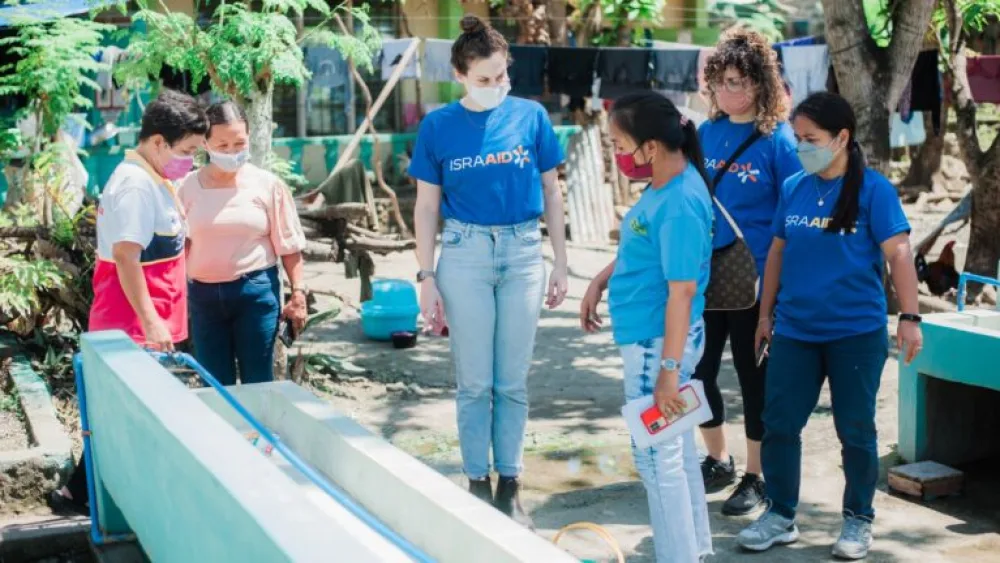 IsraAID workers aiding residents of Southern Leyte, Philippines, Feb. 16, 2022. Photo by Dinah Gorra.