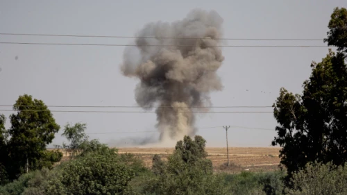 A cloud of smoke rises after a rocket launched from the Gaza Strip hit an open field near Sderot on Aug. 7, 2022. Photo by Yonatan Sindel/Flash90.