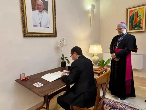 Israeli President Isaac Herzog signs the book of condolences at the Vatican's embassy in Tel Aviv as Apostolic Nuncio Adolfo Tito Camacho Yllana watches, May 2, 2025. Credit: President's Spokesperson.