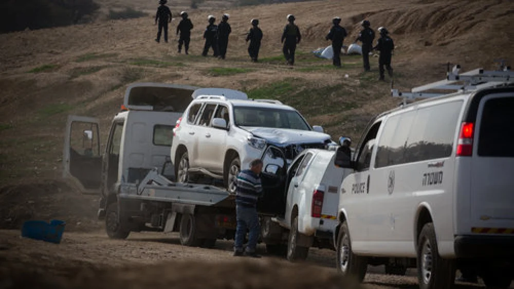 A tow truck removes the vehicle driven in the Jan. 18 car-ramming that killed Israel Police Advanced Staff Sgt. Maj. Erez Levi, 34, during protests against the demolition of the illegal Bedouin village of Umm al-Hiran. Israeli officials described the incident as a terrorist attack. Credit: Hadas Parush/Flash90.