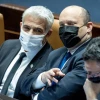 Israeli prime minister Naftali Bennett (center), Foreign Minister Yair Lapid (left) and Justice Minister Gideon Saar in the Knesset assembly hall, Jan. 17, 2022. Photo by Yonatan Sindel/Flash90.