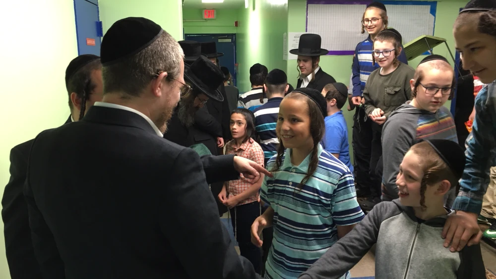 Rabbi Menachem Bombach meeting with children in New York City. Credit: Courtesy.