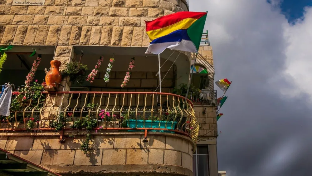 A Druze flag flies in Daliat el-Carmel. Photo by Harvey Sapir Photography via Pikiwiki Israel.
