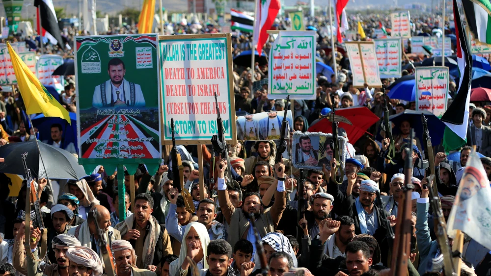 Supporters of the Houthi authorities brandish their weapons during a protest against Saudi intervention in Yemen, in Sanaa, on Oct. 9, 2026. Photo by Mohammed Huwais / AFP via Getty Images.
