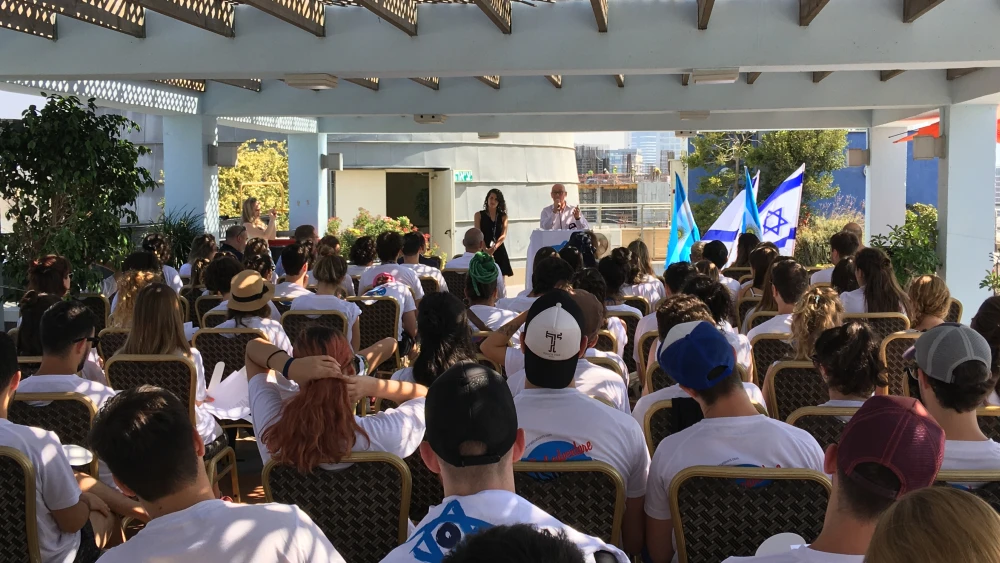 Jorge Zak, vice president of Taglit in South America, addresses the young audience at a memorial for the 85 people killed at the AMIA (Argentine Israelite Mutual Association) building in Buenos Aires, July 18, 2018. Credit: Taglit-Birthright Israel.
