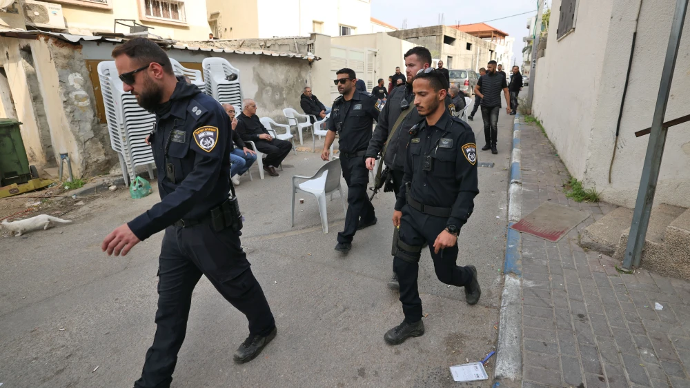 Israeli police officers walk in Kafr Qasim, an Arab city in central Israel east of Tel Aviv, following a reported overnight car-ramming attack on Dec. 23, 2022. Photo by Ahmad Gharabli/AFP via Getty Images.